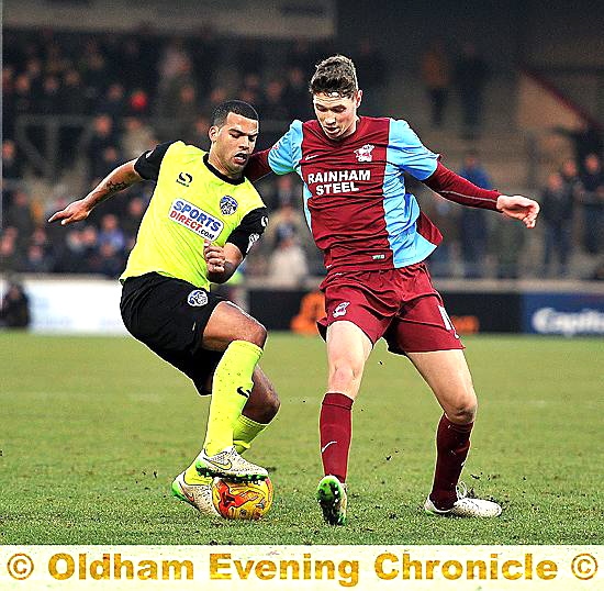 SUITABLY IMPRESSED: Jacob Mellis (left) in action against Scunthorpe. SUITABLY IMPRESSED: Jacob Mellis (left) in action against Scunthorpe.