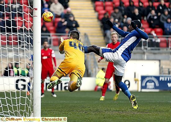 Athletic striker Jonathan Forte is beaten to the ball by Alex Cisak.