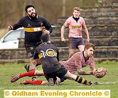 THAT’LL DO NICELY: Ryan North dives over the line to score a try.