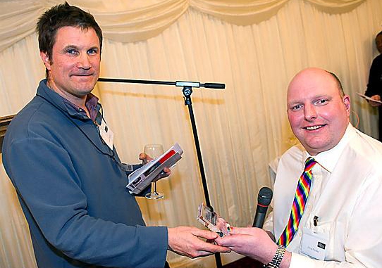 DOUG Paulley, right, receives his award from SMK chairman Mike Schwarz