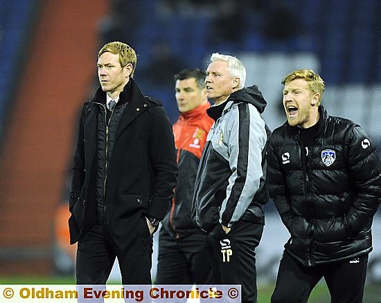 TOUCHLINE TRIO . . . Dean Holden (left) and his back-up men, Tony Philliskirk (centre) and Adam Lockwood, offer the Athletic team their advice and support during last night’s 3-1 loss against MK Dons.