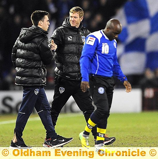 PUT IT THERE . . . Athletic boss Dean Holden congratulates Rhys Turner at the end of the Rochdale game on Tuesday.