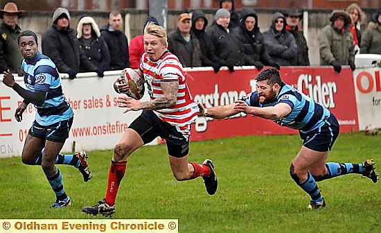NO QUARTER GIVEN: Oldham defenders get tough (left), while George Tyson rampages downfield in theWhitebank win.