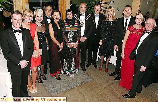 Having a ball (l-r): school business manager Michael Unsworth, Caroline Whitmore, head teacher Anne Redmond, John and Debbie Abrahams, Mayor and Mayoress of Oldham, Councillor Fida Hussain and Tanvir Hussain, John Stapleton, Lynn Faulds-Wood, Barrie McDermott, Terri Unsworth and Chris Redmond.