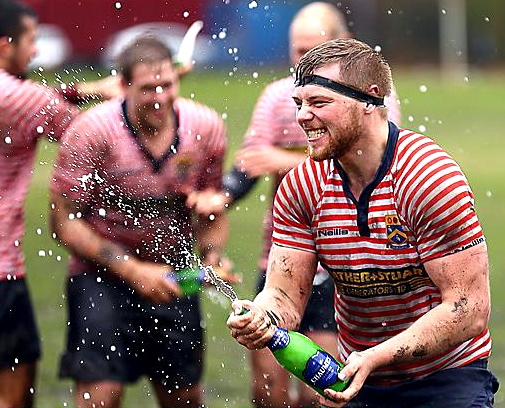 Lewis Simister celebrates promotion. 