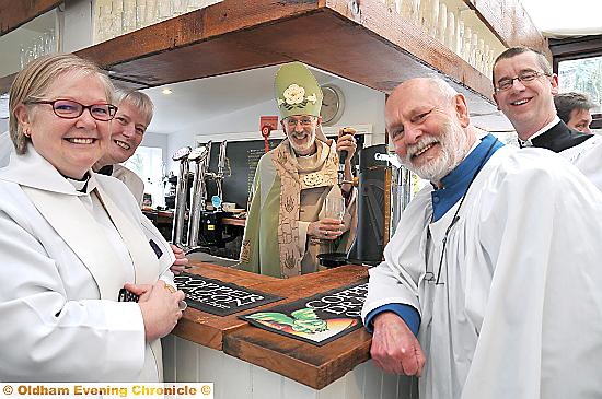 MINE’S a pint . . . the bishop behind the bar at the Church Inn