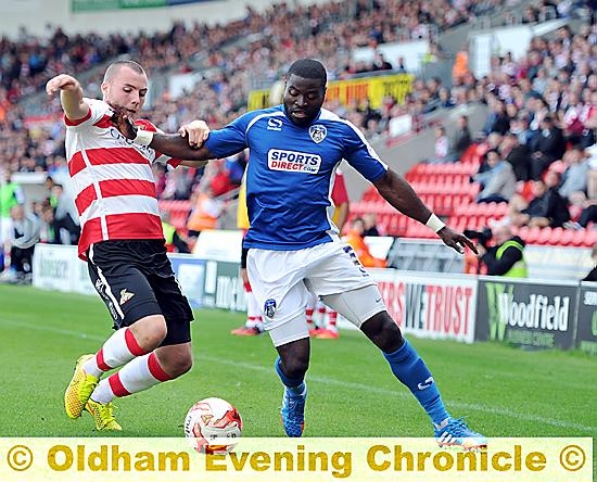 COMMITTED: George Elokobi (right) hopes to feature for Athletic tomorrow.