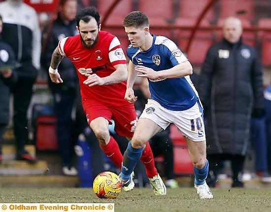 ON THE FRONT FOOT: Athletic forward Danny Philliskirk sets up an attack.