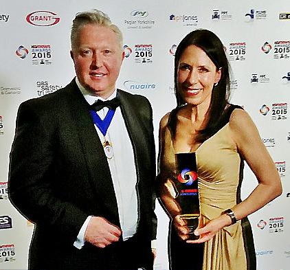 Pictured at the construction industry’s H&V Awards are Debbie Abrahams, with her gold award, and Jim Marner, president-elect of Building and Engineering Services (B&ES)
