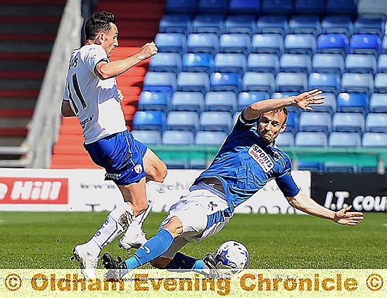 skipper Liam Kelly tries to win the ball with a sliding challenge.