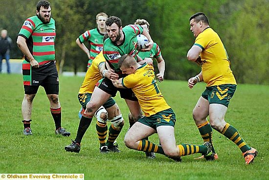 MARTIN Sarsfield is held by two Hunslet Club Parkside rivals. MARTIN Sarsfield is held by two Hunslet Club Parkside rivals.