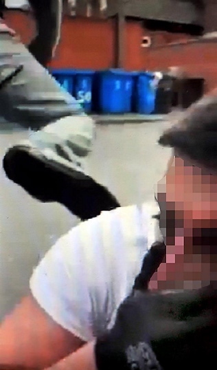CAUGHT on camera — the robbery suspect is kicked after being caught while running away CAUGHT on camera — the robbery suspect is kicked after being caught while running away