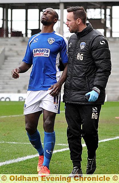 pain game: Jonathan Forte is helped away after picking up a knee injury late on against Bristol City.