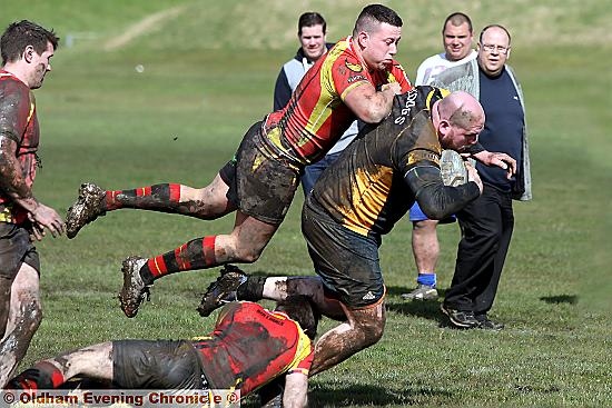 Michael Hall is stopped close to the Wigan try line.