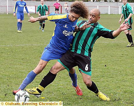 CLOSE CALL . . . Carrion’s Ashley Grant (left) tackles Carlton McKenzie.
