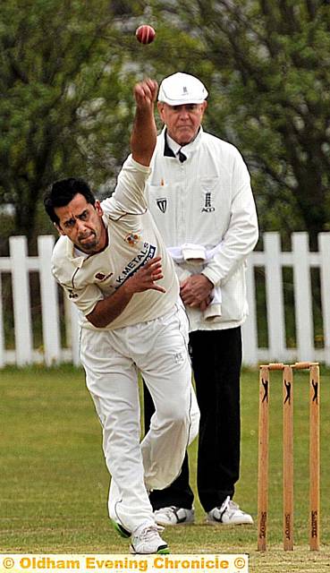 MOHAMMED Irfan in delivery stride for Austerlands against Micklehurst. MOHAMMED Irfan in delivery stride for Austerlands against Micklehurst.