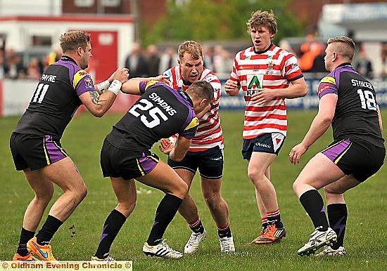 GETTING TO GRIPS: Danny Langtree prepares to be tackled by Thunder’s Evan Simons.