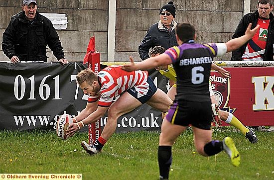 TOUCHDOWN! Oldham fans shout home Adam Clay as the winger adds to his team’s tally against Newcastle Thunder. 