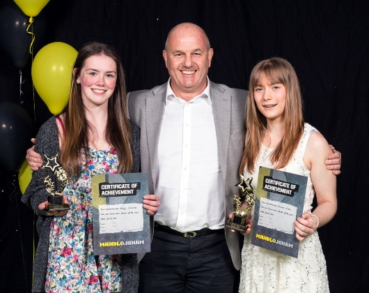 Senior Members of the year Emily Edwards and Shannon Green with Mahdlo chairman Terry Flanagan.
