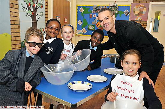 TOP chefs in the making: MasterChef winner Simon Wood at Christ Church Primary School (l-r) Joe Smedley, Estelle Mushiko, Lilia Evans, David Omodele, Simon Wood and Simon’s daughter Charlotte