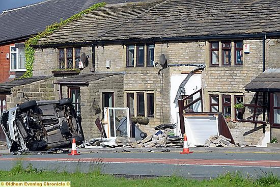 The car demolished a porch as it came to rest