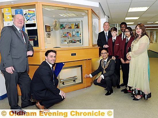 Pictured (from left, school historian and teacher Mike Russell with Andy Potts, head of humanities; the Mayor, Cllr Ateeque ur-Rehman; school principal Dave McEntee; Adam Anderton, Tomi Akingbehin, Maisha Rahman and the mayoress Yasmin Toor).