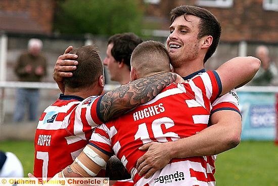 WELL DONE, LADS: Oldham men Steve Roper (left), Kenny Hughes and Lewis Palfrey celebrate a comprehensive victory. 
