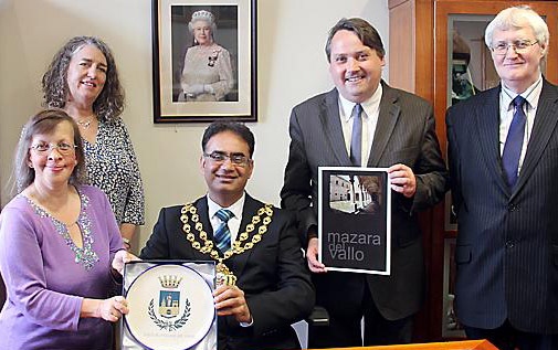 OLDHAM’S pledge . . . the Mayor of Oldham, Councillor Ateeque Ur-Rehman, presented with the Coat of Arms from Mazara Del Vallo by Peace Talks Oldham members