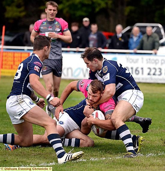 powering through . . . Josh Crowley forces his way over to increase Oldham’s lead against Swinton Lions. PICTURE by TIM BRADLEY