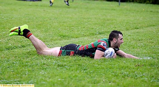 ON THE MARK: Jamie Mayall bursts through the Drighlington back line to score Waterhead’s first try