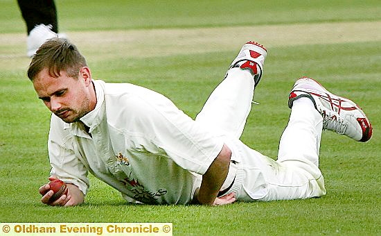 PAIN GAME: for Crompton fieldsman Stephen Wright, who takes a fine catch to remove Ashton’s Brad Woolley.