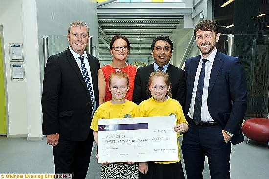 MONEY for Mahdlo (back, from left) Steve Kilroy, Oldham Business Awards steering group chairman, with Louise Slater, steering group members Kashif Ashraf and Adam Husband, (front): Mackenzie Kielty and Natasha Flanagan, representing Mahdlo.