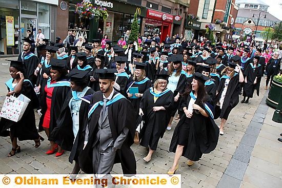 FORWARD march . . . graduates parade through the town centre