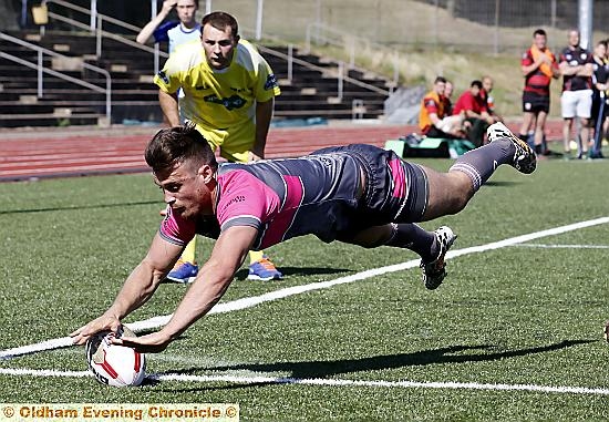 ACROBATICS: Lewis Palfrey touches down for his second try.