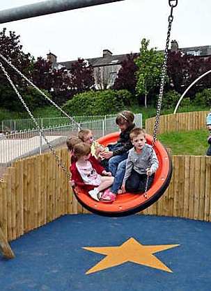 CHILDREN try out the new play area dedicated to Jamie. CHILDREN try out the new play area dedicated to Jamie.