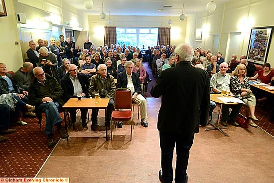 Chairman Ken Bennett opens the packed meeting.