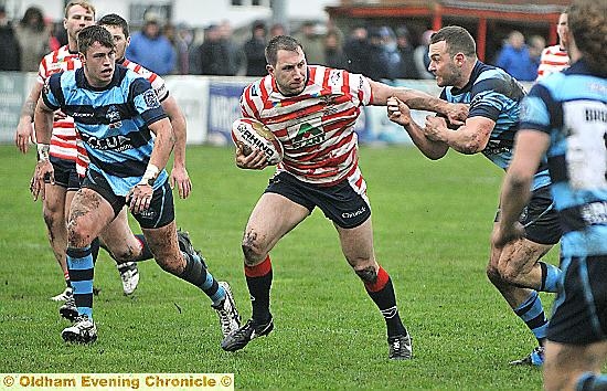 NEW LEASE OF LIFE: Prop forward Adam Neal (centre) is enjoying his return to rugby league with Oldham.