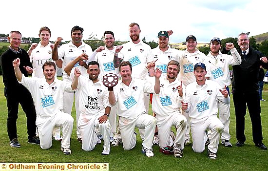 WHAT A FEELING: Saddleworth’s players celebrate alongside joint team manager Peter Gill (left) and scorer Paul Seddon. WHAT A FEELING: Saddleworth’s players celebrate alongside joint team manager Peter Gill (left) and scorer Paul Seddon.
