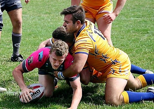 Gareth Owen spins out of the tackle and scores the first of Oldham’s tries.