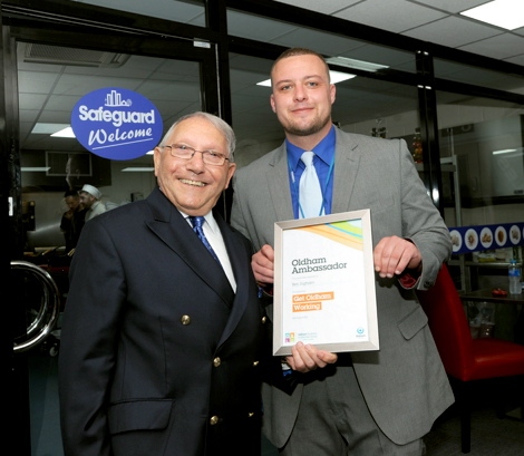Norman Stoller presents a Get Oldham Working ambassador certificate to Ben Ingham of Safeguard Group during the event Norman Stoller presents a Get Oldham Working ambassador certificate to Ben Ingham of Safeguard Group during the event