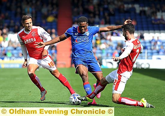 NOWHERE TO GO . . . Dominic Poleon is trapped by a Fleetwood pincer movement.