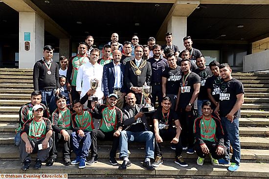 Oldham Dragons and Oldham Tigers met the Mayor (centre) to show off their trophies. Holding the cups are team managers Miftha Miah (centre left) for the Tigers and Nanu Miah (centre right). Oldham Dragons and Oldham Tigers met the Mayor (centre) to show off their trophies. Holding the cups are team managers Miftha Miah (centre left) for the Tigers and Nanu Miah (centre right).