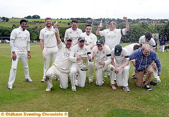 WE’VE DONE IT! . . . the Saddleworth team celebrate with the Tanner Cup.