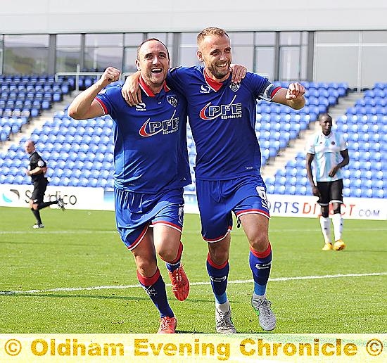 WELL DONE, MATE . . . Lee Croft (left) congratulates success