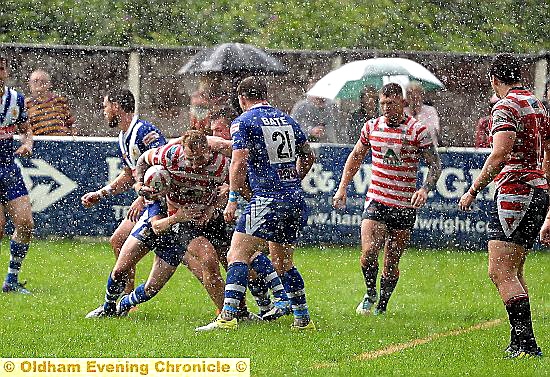 DANNY Langtree drives through the rain at the Whitebank.
