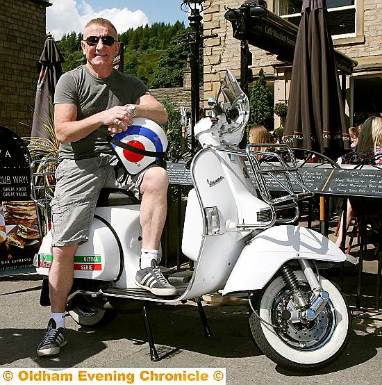 MOD-ERN classic:Sweeney tries our man Simon Smedley’s scooter for size. MOD-ERN classic:Sweeney tries our man Simon Smedley’s scooter for size.