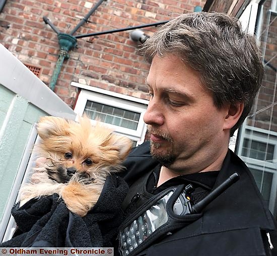 Sergeant Jon Martin rescues one of the dogs