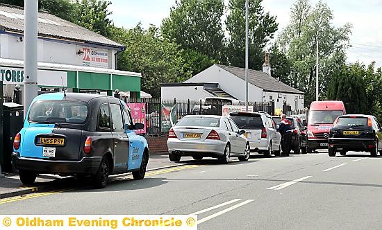 Cars blatantly flout the road markings in Chamber Road