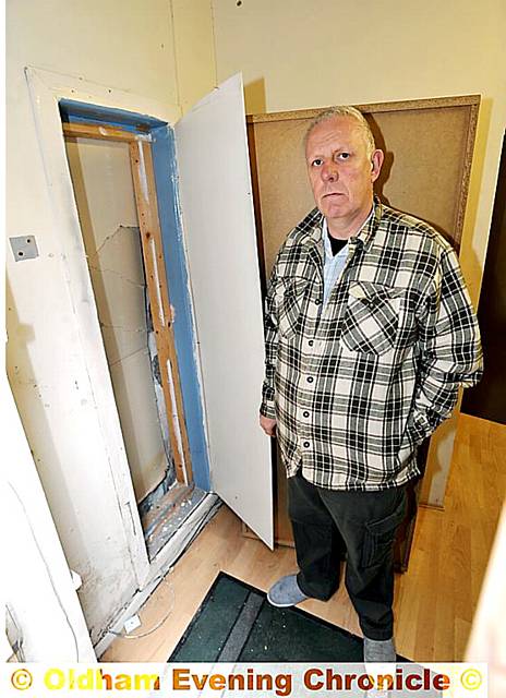 Rod Smith, chairman and founder of Animal Rescue Oldham, inspects the damage
