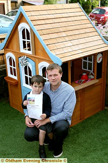 Jacob, his dad Michael, and the house at the centre of the row